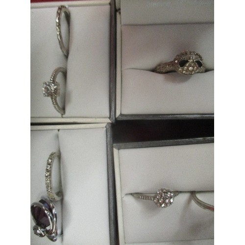 24 - 5 BOXES OF DRESS RINGS (9 RINGS IN TOTAL), PURPLE, BLACK & WHITE STONES. ALL IN WHITE METAL - UNMARK... 