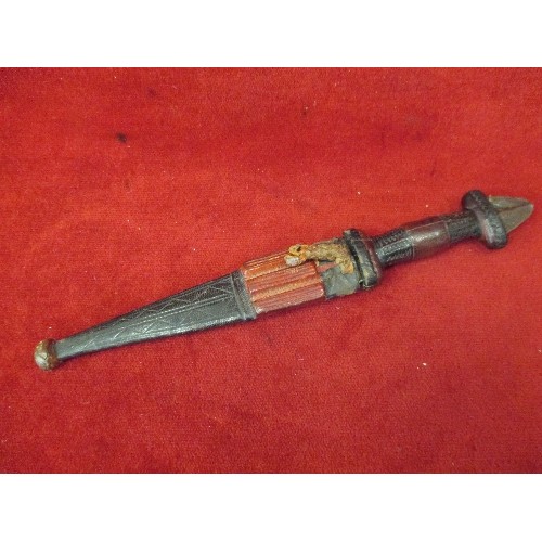 50 - DECORATIVE AFRICAN LEATHER COVERED DAGUAR  IN A CARVED LEATHER SHEATH