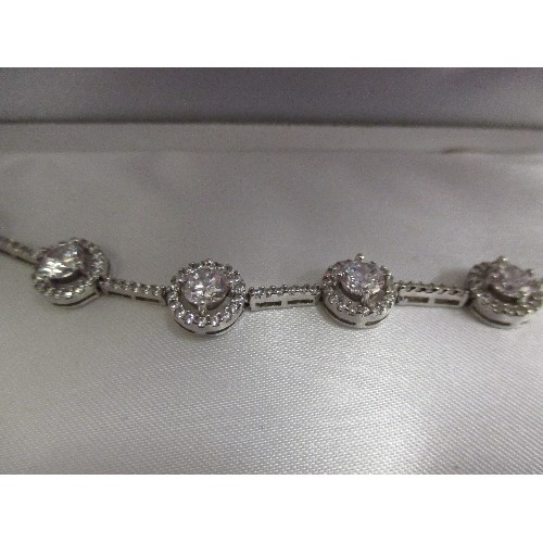 38 - AN ELEGANT SILVER HALLMARKED BRACELET SET WITH HALO SET WHITE STONES - WITH BOX