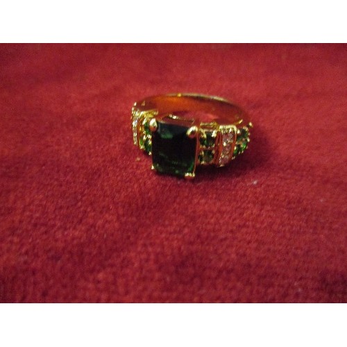 16 - EMPEROR STYLE GILT RING WITH EMERALD COLOUR STONES  - SIZE T / U