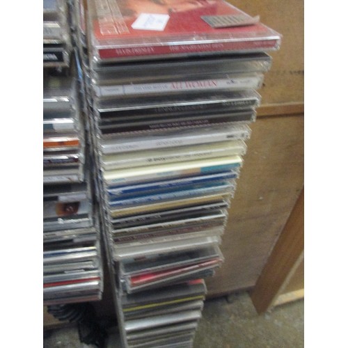 391 - QUANTITY OF CD'S IN A STAND INCL FLEETWOOD MAC, ELVIS, SHERYL CROW ETC