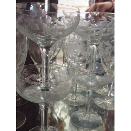 54 - GOOD MATCHING SET OF 9 WINE GLASSES AND 4 CHAMPAGNE COUPES ETCHED WITH FLOWER DESIGN