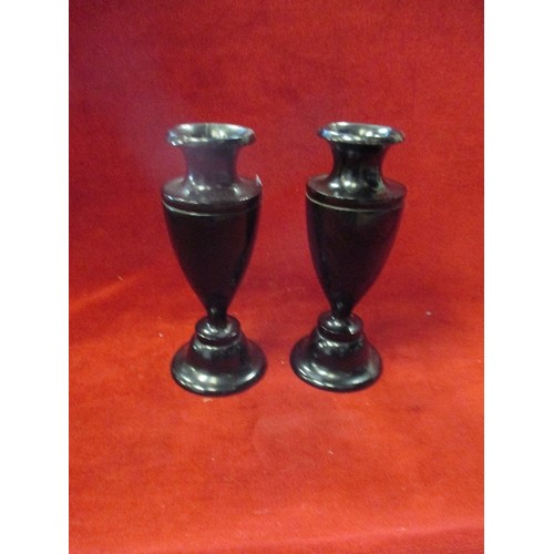 228 - PAIR OF TURNED EBONY CANDLESTICKS (REPAIR TO RIMS)