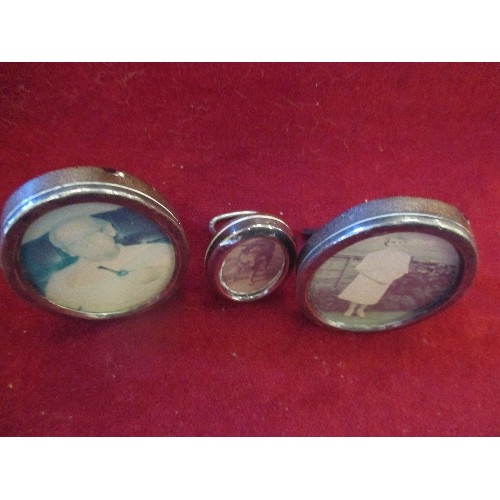 11 - PAIR OF STERLING SILVER OVAL PHOTOGRAPH FRAMES (8CM) MARKED 925 AND A MINIATURE ONE (4.5CM)MARKED 