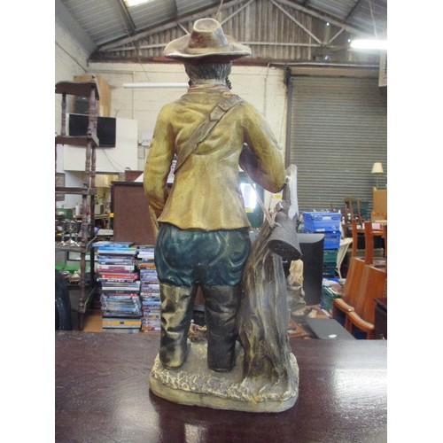 178 - LARGE POTTERY FIGURE OF HUNTER WITH HIS DOG AND GUN- 54CM HIGH