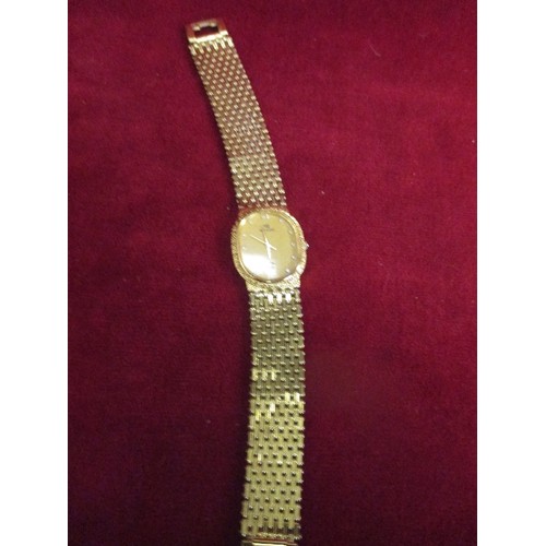 15 - LADIES SWISS ROGADIS WATCH WITH 24K GOLD PLATED FACE AND STRAP. FACE SET WITH CRYTSAL NUMERALS