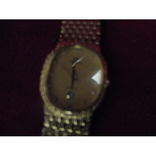 15 - LADIES SWISS ROGADIS WATCH WITH 24K GOLD PLATED FACE AND STRAP. FACE SET WITH CRYTSAL NUMERALS