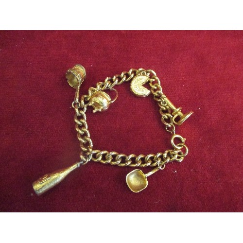 22 - GILT METAL CHARM BRACELET WITH COOKING POT, CHAMBERSTICK, SWISS CHEESE CHARMS