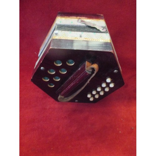 380 - AN EARLY 20TH CENTURY 20 BUTTON CONCERTINA IN ITS ORIGINAL BOX