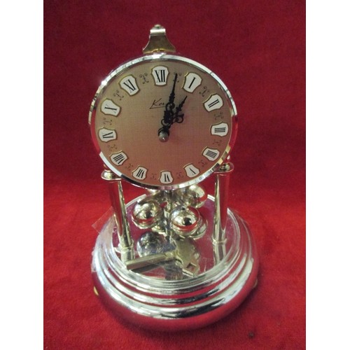 352 - A 400 DAY KERN OF GERMANY CHROME PLATED TORSION ANNIVERSARY CLOCK IN GOOD CONDITION