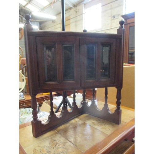 359 - EDWARDIAN SMALL CORNER CABINET, THE DOORS WITH BEVELLED GLASS, ON TURNED WOOD SUPPORTS