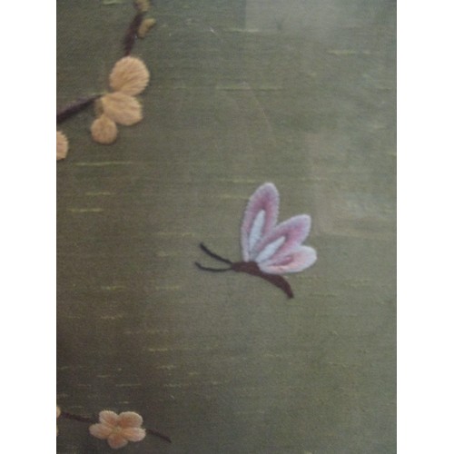 171 - EARLY 20TH CENTURY SILK EMBROIDERY OF BLOSSOM & BUTTERFLIES IN THE JAPANESE STYLE - FRAMED AND GLAZE... 