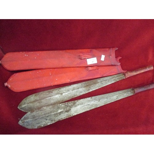 66 - PAIR OF AFRICAN TRIBAL MACHETES IN RED ANIMAL SKIN SHEATHES