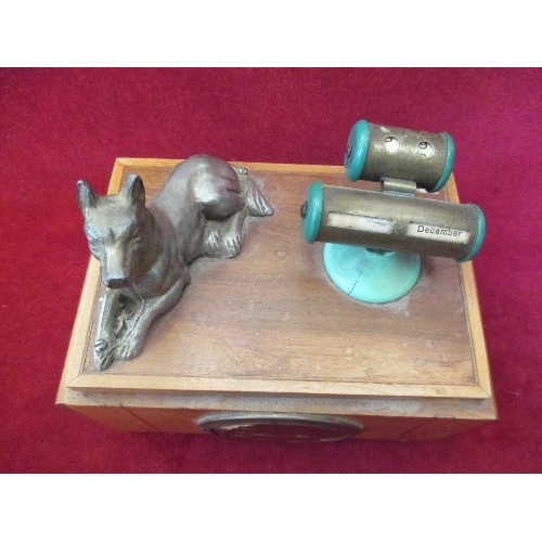 24 - VINTAGE MUSICAL  CIGARETTE BOX AND DESK STAND WITH CALENDAR AND METAL FIGURE OF AN ALSATION