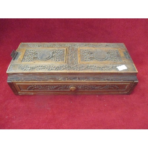 132 - OLD CARVED WOODEN BOX, WITH DRAWER, AND 2 SLIDING PANELS ON THE LID. 29CM L.