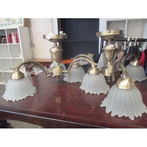 161 - 2 GLASS AND ANTIQUE EFFECT BRASS CEILING LIGHTS, EACH WITH 3 FROSTED TULIP SHADES.