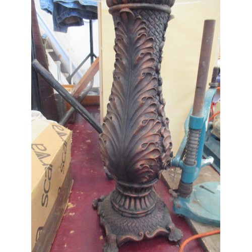 194 - CIRCULAR TOPPED GLASS [51CM DIAM] SIDE TABLE, WITH HEAVY ORNATE COPPER RESIN BASE. APPROX 61CM H.