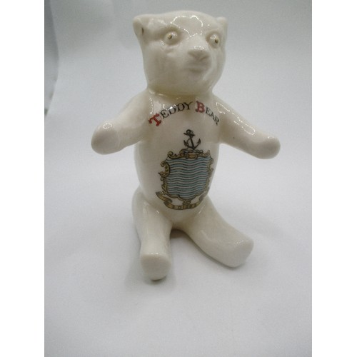 17 - CRESTED WARE CARLTON CHINA TEDDY BEAR FIGURE WITH DISS, NORFOLK CREST AND A CARLTON CHINA PIG WITH C... 