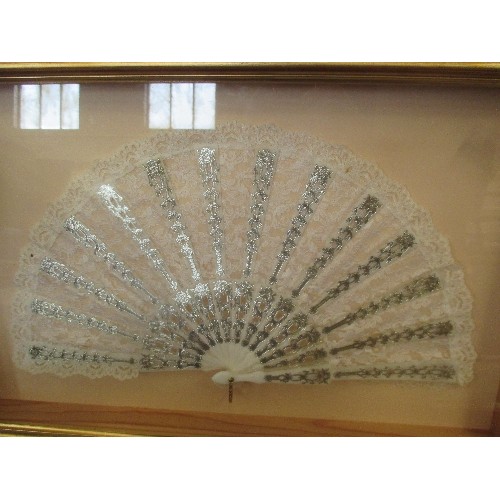 119 - FRAMED DECORATIVE LACE FAN WITH SILVER DETAIL, FRAME SIZE 56 X 36CM.