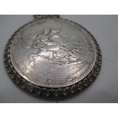 98 - A GEORGE III 1820 CROWN IN EF CONDITION FRAMED AS A MEDALLION ON A SILVER CHAIN MARKED 