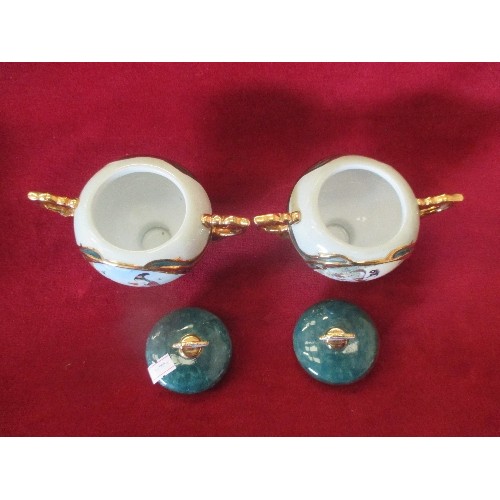 80 - HEIRLOOM PORCELAIN MUSIC BOX COLLECTION. A PAIR OF LIDDED POTS 'BEAUTIES OF THE RED MANSION'