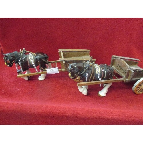 131 - A PAIR OF SHIRE/HEAVY HORSE ORNAMENTS, WITH HAND-MADE WOODEN CARTS.