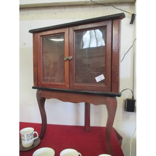 261 - SMALL FREE-STANDING GLASS CORNER CABINET ON CABRIOLE LEGS.