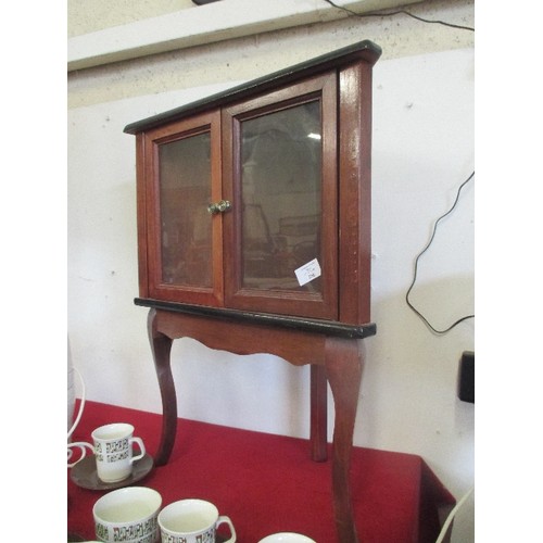 261 - SMALL FREE-STANDING GLASS CORNER CABINET ON CABRIOLE LEGS.