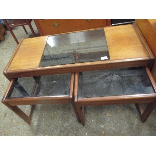 338 - 1970'S RETRO NEST OF TEAK AND GLASS TABLES BY SUNELM