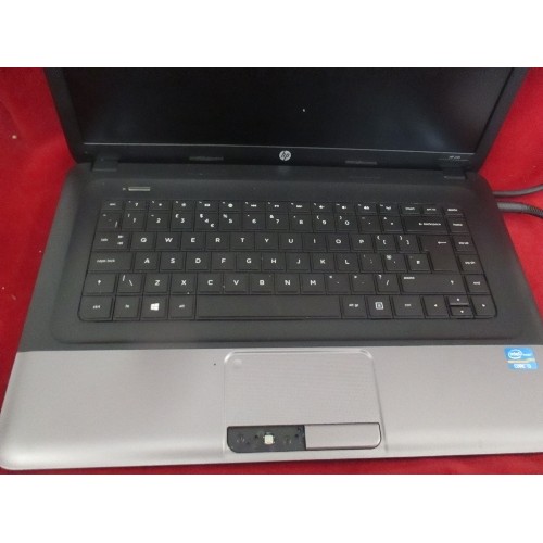 321 - HP LAPTOP - STARTS UP - APPEARS GOOD COND BUT MISSING A KEY COVER BELOW THE TOUCHPAD