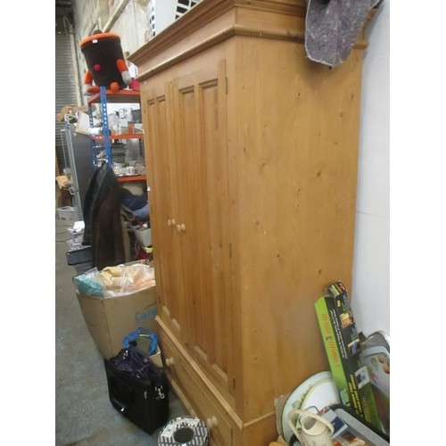 528 - LARGE SOLID PINE FARMHOUSE / HOUSEKEEPERS TYPE STORAGE CUPBOARD WITH PANELLED DOORS AND DRAWER BELOW... 