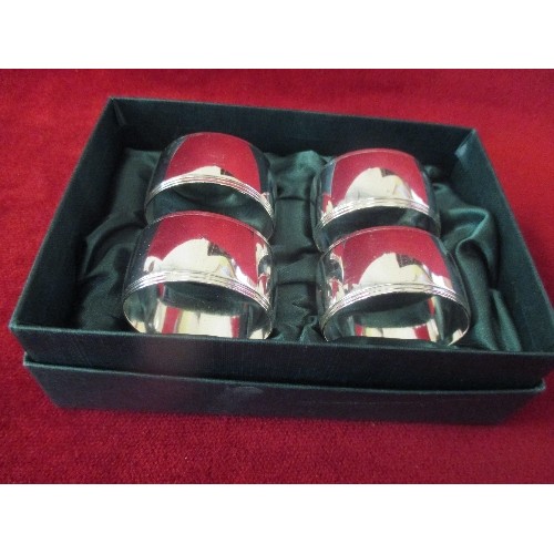 28 - BOXED SET OF OVAL SHAPED SILVER PLATED NAPKIN RINGS