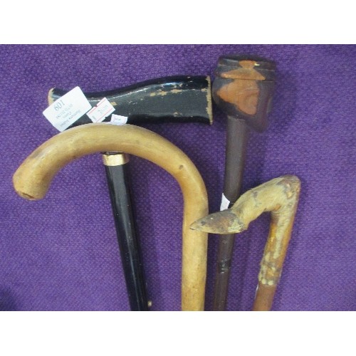 109 - 4 VINTAGE WALKING STICKS, INCLUDES AN ANIMAL FOOT/HOOF HANDLE.