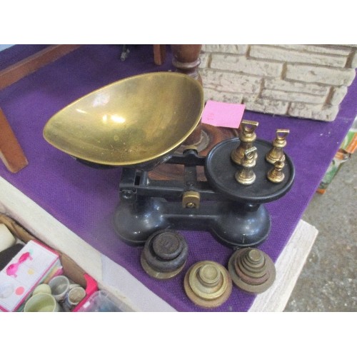 130 - VINTAGE IRON AND BRASS KITCHEN SCALES TOGETHER WITH SEVERAL SETS OF WEIGHTS