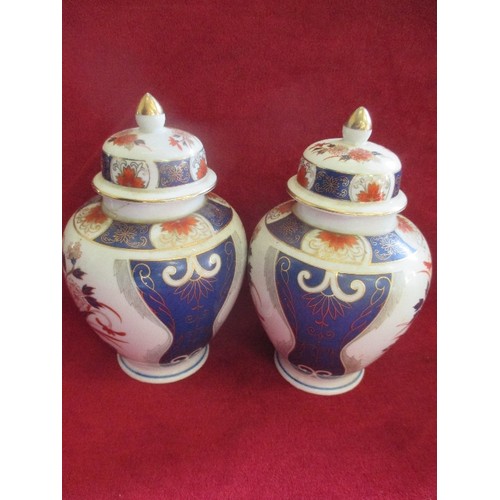 3 - PAIR OF PORCELAIN LIDDED JARS DECORATED IN IMARI COLOURS - 20CM  - ONE HAS REPAIR