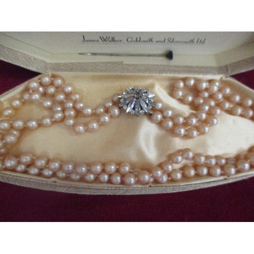 29 - 1950'S DOUBLE STRAND OF SIMULATED PEARLS WITH A LARGE DIAMANTE CLASP - ORIGINAL 