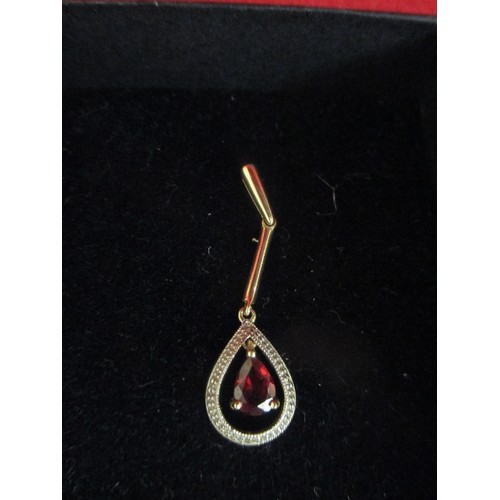 57 - A 9CT GOLD PENDANT WITH PEAR SHAPED GARNET - 4CM, 1.6 GRAMS