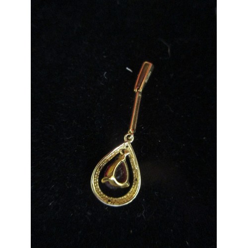 57 - A 9CT GOLD PENDANT WITH PEAR SHAPED GARNET - 4CM, 1.6 GRAMS