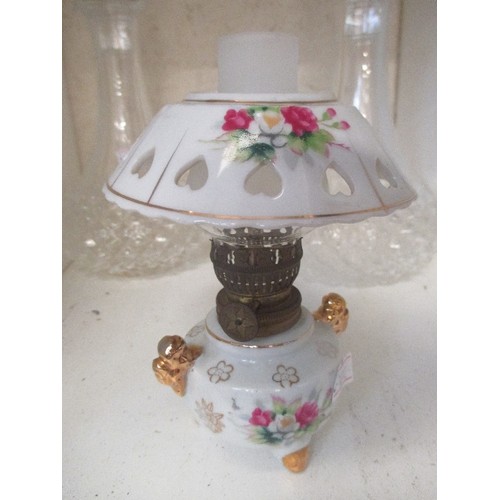 426 - 2 CUT GLASS DECANTERS AND VINTAGE CERAMIC MINIATURE OIL LAMP