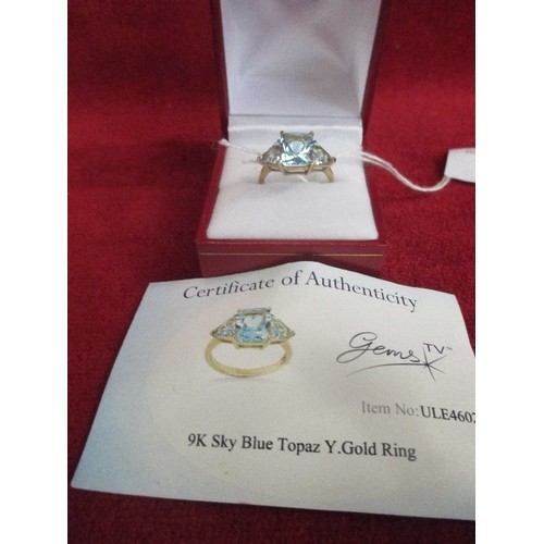 25 - A 9CT GOLD DRESS RING SET WITH THREE SKY BLUE TOPAZ - TOGETHER WITH A CERTIFICATE - BIRMINGHAM HALLM... 