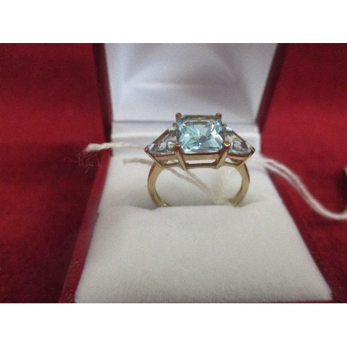 25 - A 9CT GOLD DRESS RING SET WITH THREE SKY BLUE TOPAZ - TOGETHER WITH A CERTIFICATE - BIRMINGHAM HALLM... 