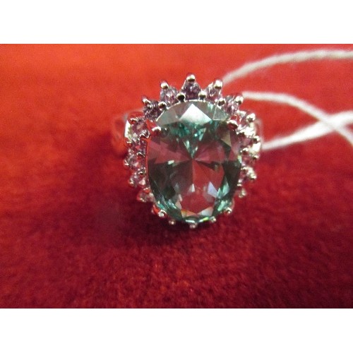 26 - A STUNNING 925 SILVER DRESS RING SET WITH A LARGE PALE GREEN STONE (14MM X 10MM) - SURROUNDED BY CZ ... 