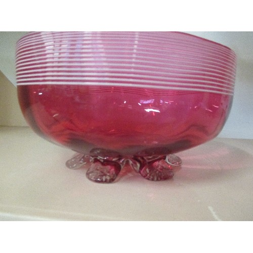 179 - A VICTORIAN CRANBERRY GLASS MILK JUG AND SUGAR BOWL WITH WHITE TRAILING AND PETAL FEET - JUG 10CM H,... 