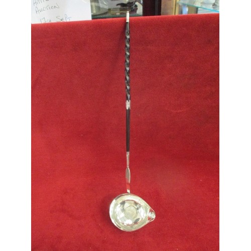 121 - A SILVER GEORGE III TODDY LADLE WITH SILVER 1 SHILLING PIECE IN THE BOWL - WHALE BONE HANDLE AND COL... 