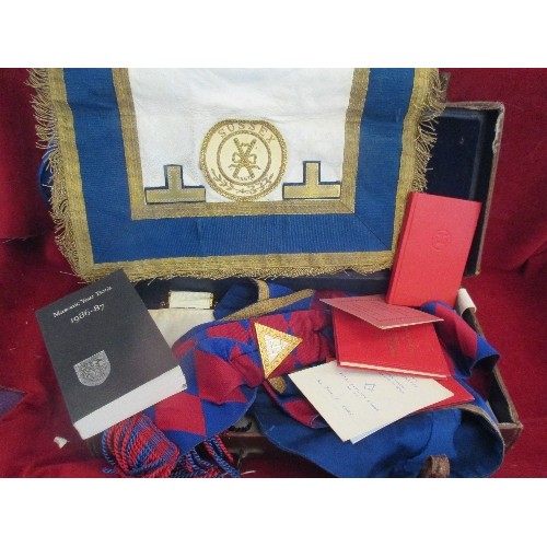 138 - MASONIC LEATHER CASE WITH CONTENTS OF APRON AND SASHES. INCLUDES AN APRON WITH SUSSEX BADGE, A BLUE ... 