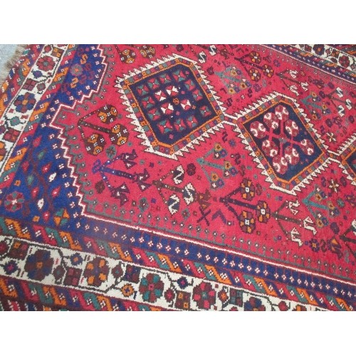 256 - A LARGE VINTAGE HAND KNOTTED TURKISH WOOL CARPET WITH GEOMETRIC PATTERN, PRIMARILY RED AND BLUE - PR... 