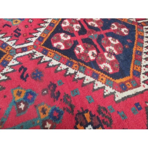 256 - A LARGE VINTAGE HAND KNOTTED TURKISH WOOL CARPET WITH GEOMETRIC PATTERN, PRIMARILY RED AND BLUE - PR... 