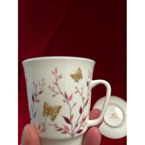 16 - A VERY ATTRACTIVE LOMONOSOV USSR, PORCELAIN CUP AND SAUCER DECORATED WITH PINK LEAVES AND GILT BUTTE... 