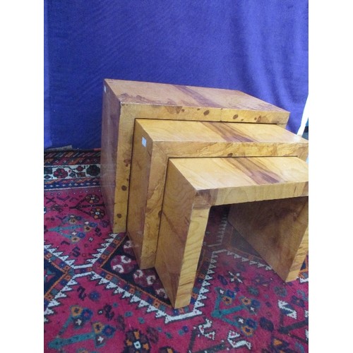 265 - A NEST OF THREE ART DECO STYLE SIDE TABLES VENEERED IN AN EXOTIC HONEY COLOURED WOOD - 60CM X 35CM X... 