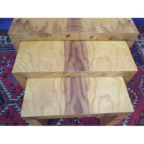 265 - A NEST OF THREE ART DECO STYLE SIDE TABLES VENEERED IN AN EXOTIC HONEY COLOURED WOOD - 60CM X 35CM X... 